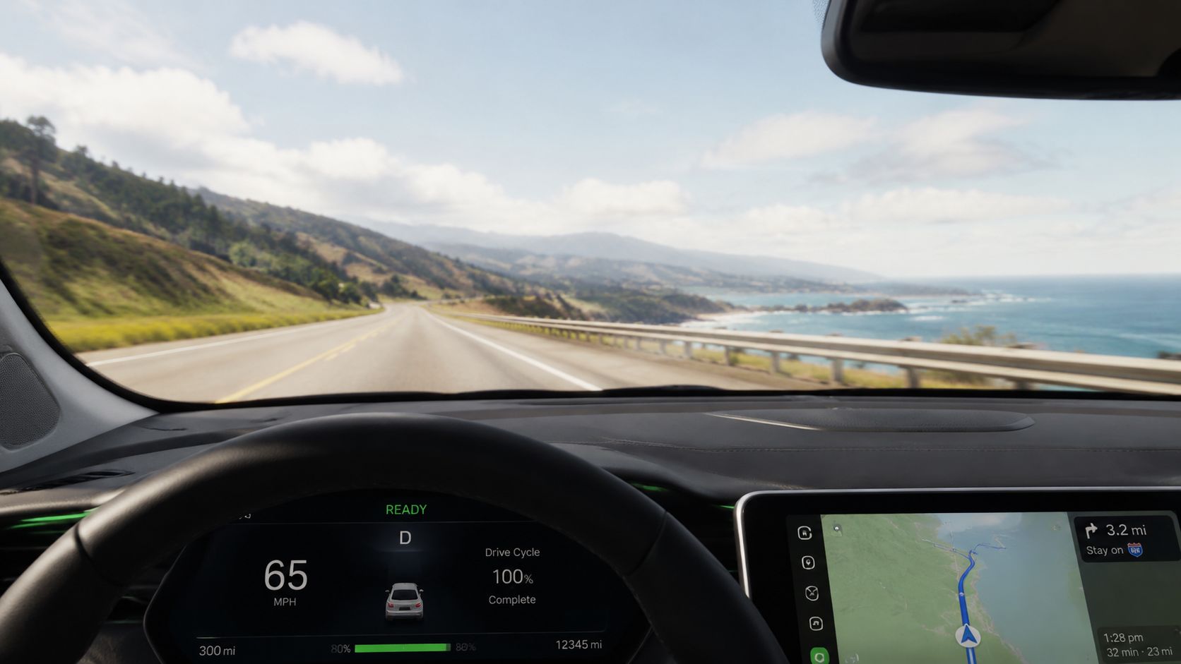 A first-person view from inside a modern car driving along a scenic coastal highway during daytime.