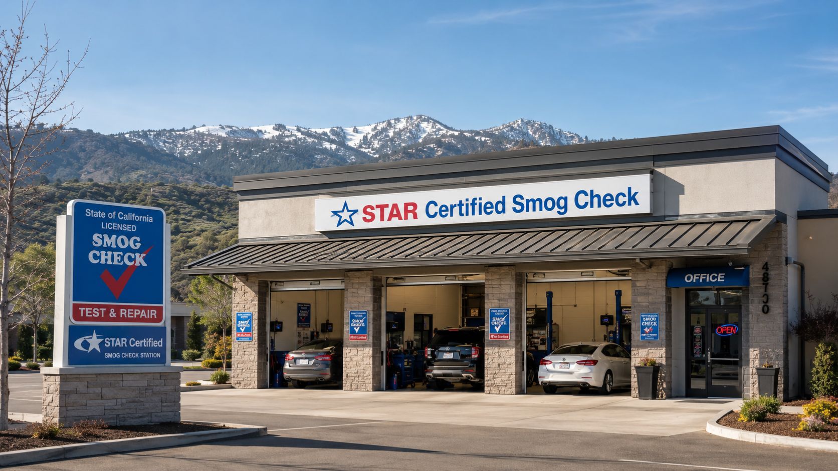 A professional STAR Certified smog check station building with parked cars and scenic mountains in the background.